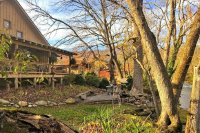 Water's Edge ~ Covered Porch w/ Deep Creek as your Backyard Haven